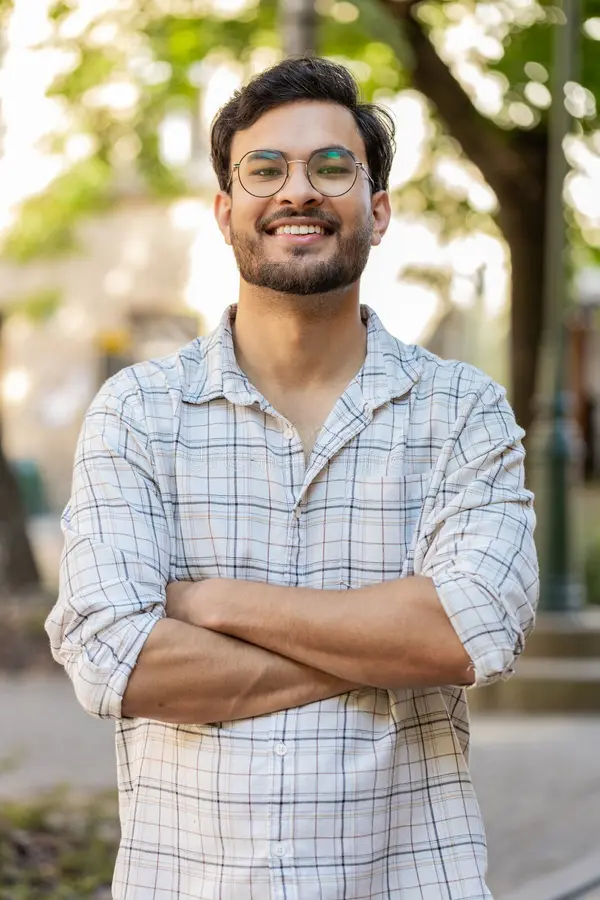 portrait-happy-smiling-indian-young-man-looking-camera-resting-relaxation-feel-satisfied-glad-expression-good-news-369943696
